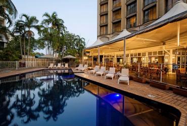 Dine at Poolside Restaurant by the outdoor pool