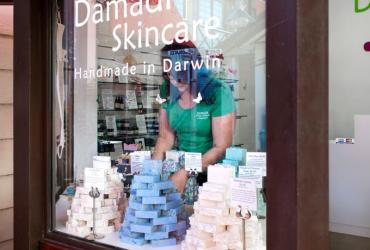 Stacks of Damadi's artisan soaps being arranged by the maker.
