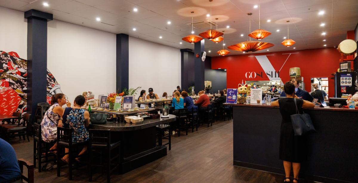 Internal shot of Go Sushi X with customers seated at sushi train